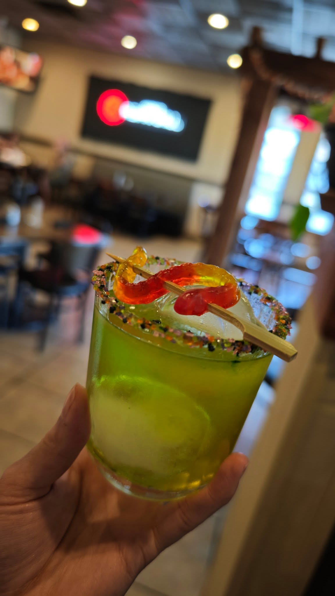 Signature cocktail with candy rim garnish