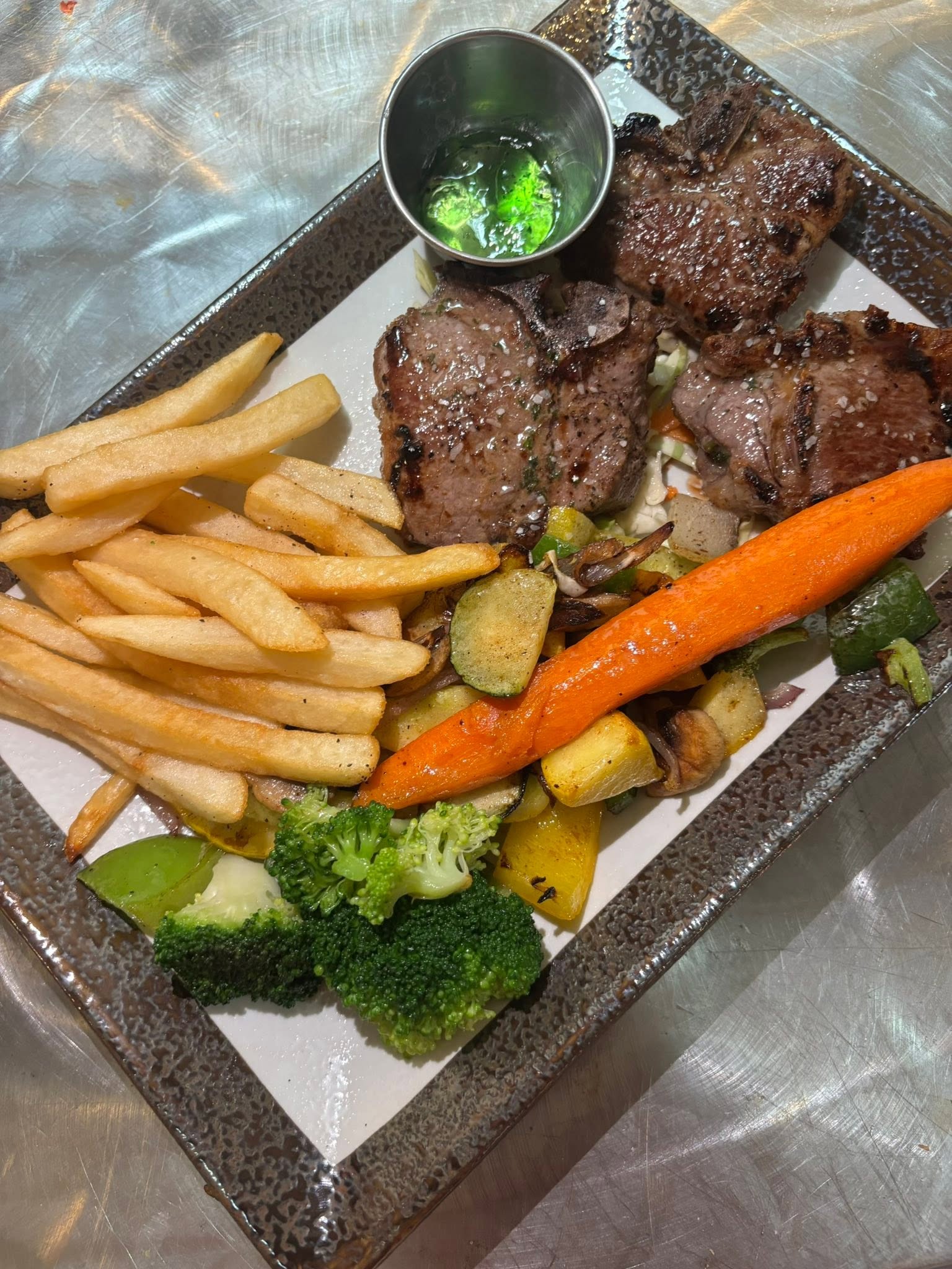 Lamb chops with fries and roasted vegetables