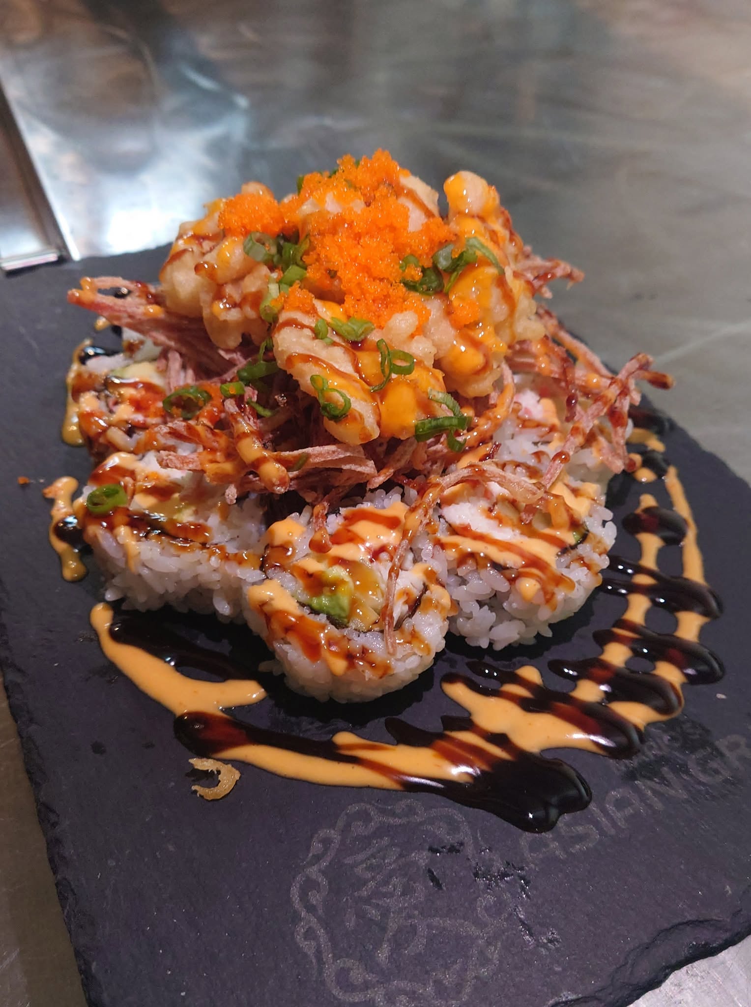 Volcano-style roll on a Mario's branded slate board