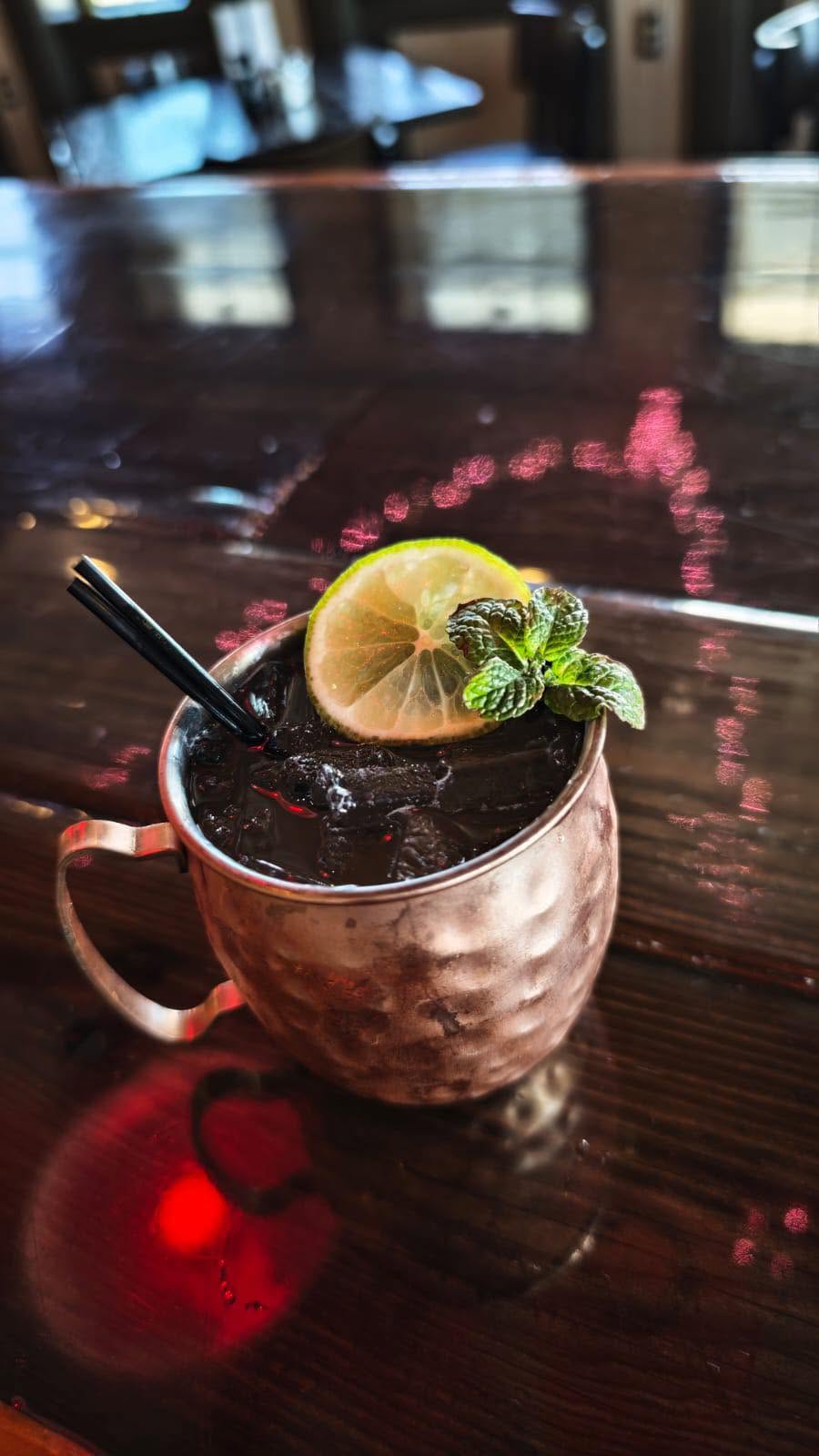Moscow mule in a copper mug on the bar at Mario's Asian Grill