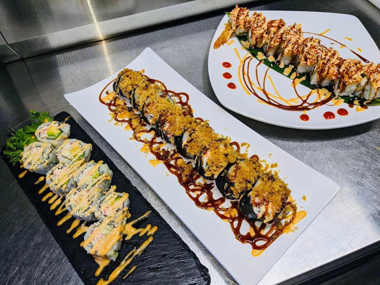 Three specialty rolls on steel prep counter