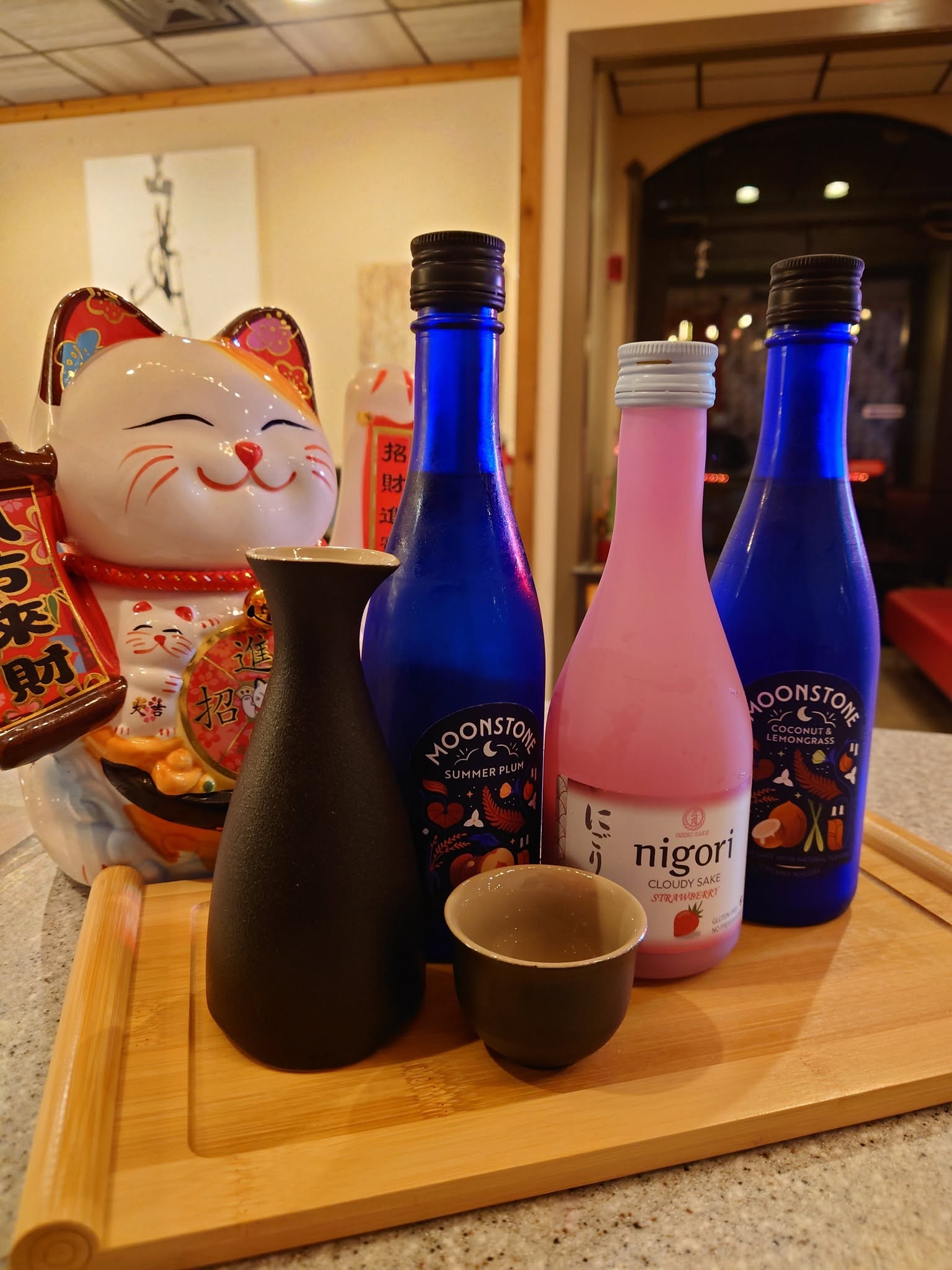 Sake selection with lucky cat at Mario's Asian Grill